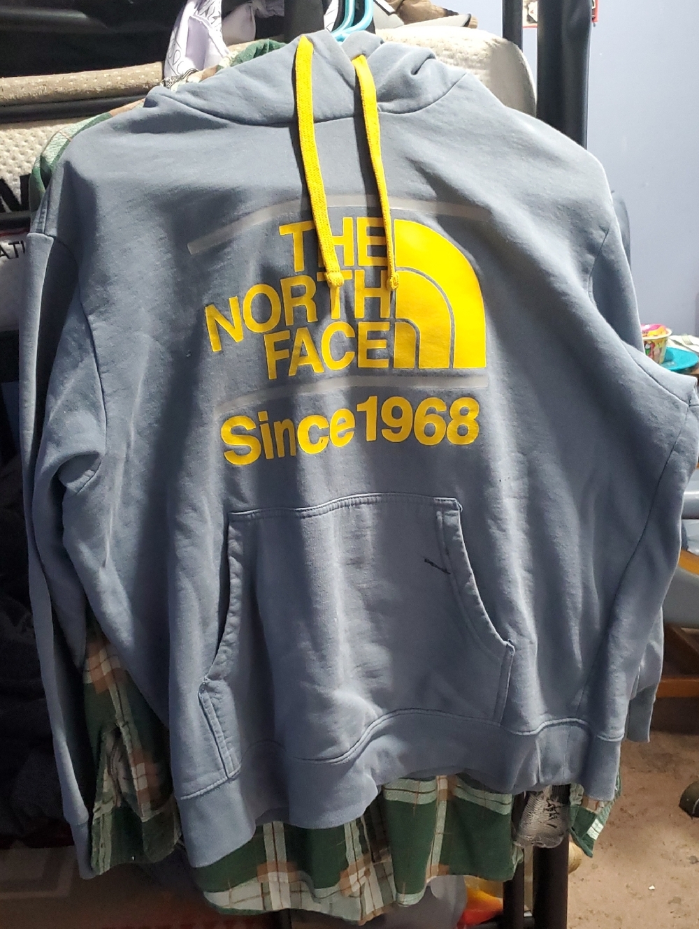 The North Face Slate Blue Hoodie with Yellow Logo and Drawstrings